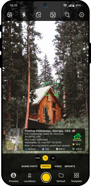 GPS camera capturing wooden cabin in forest with visible stamp